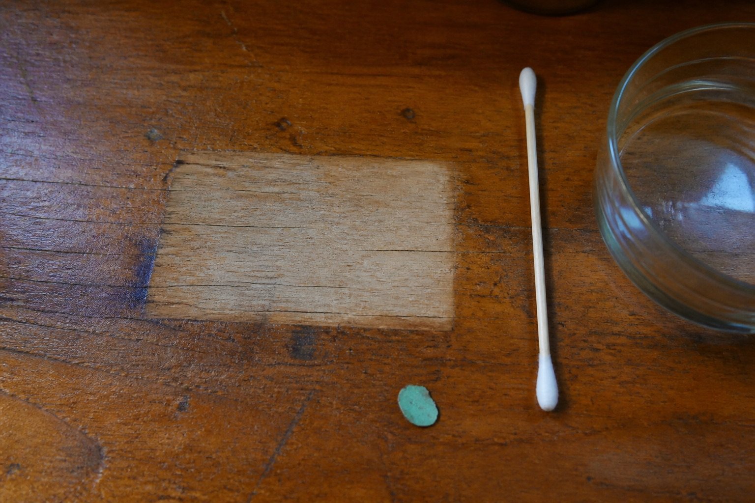 Cleaned rectangular window with pigment-green chip and glass dish