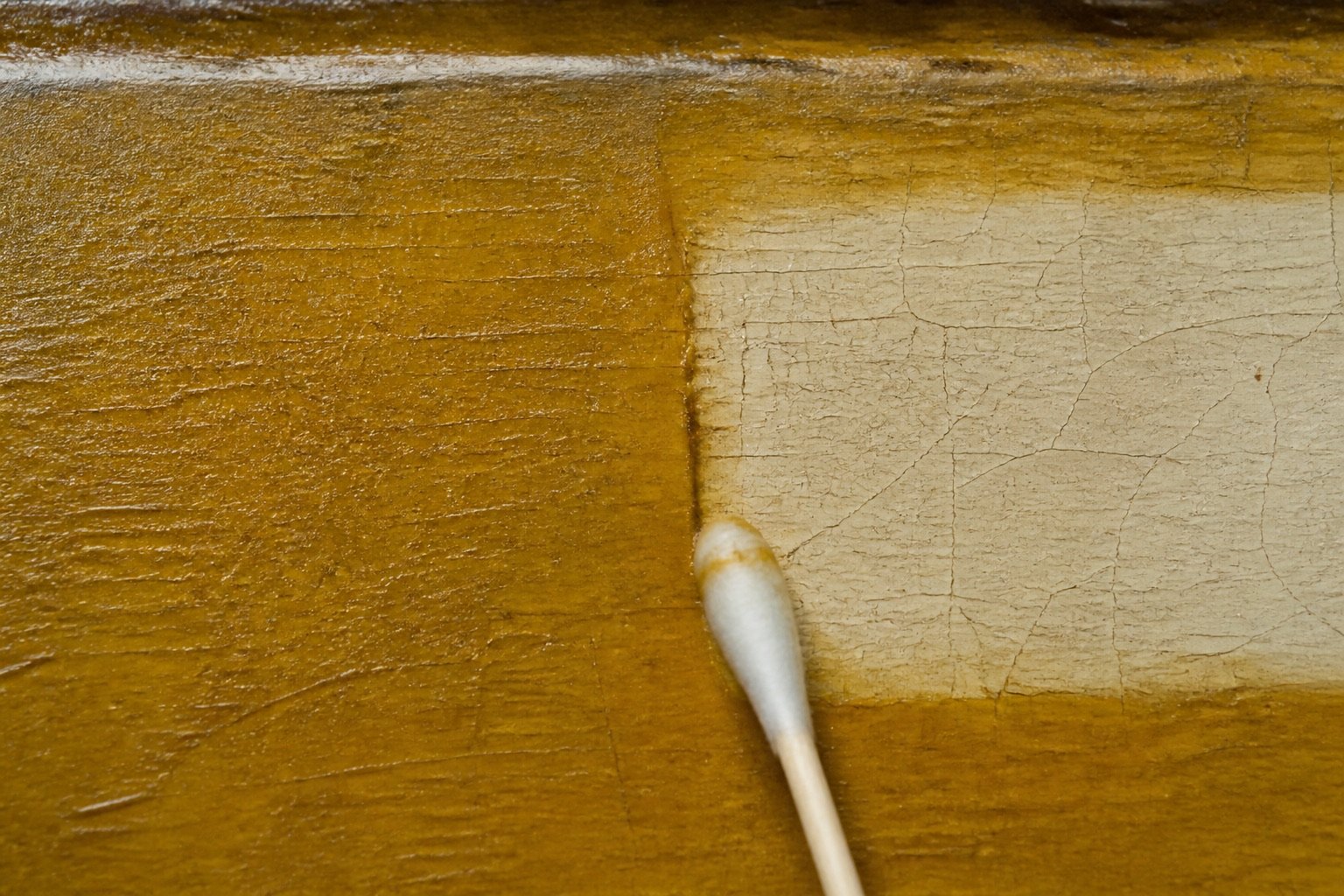 Before and after reveal strip on aged varnish