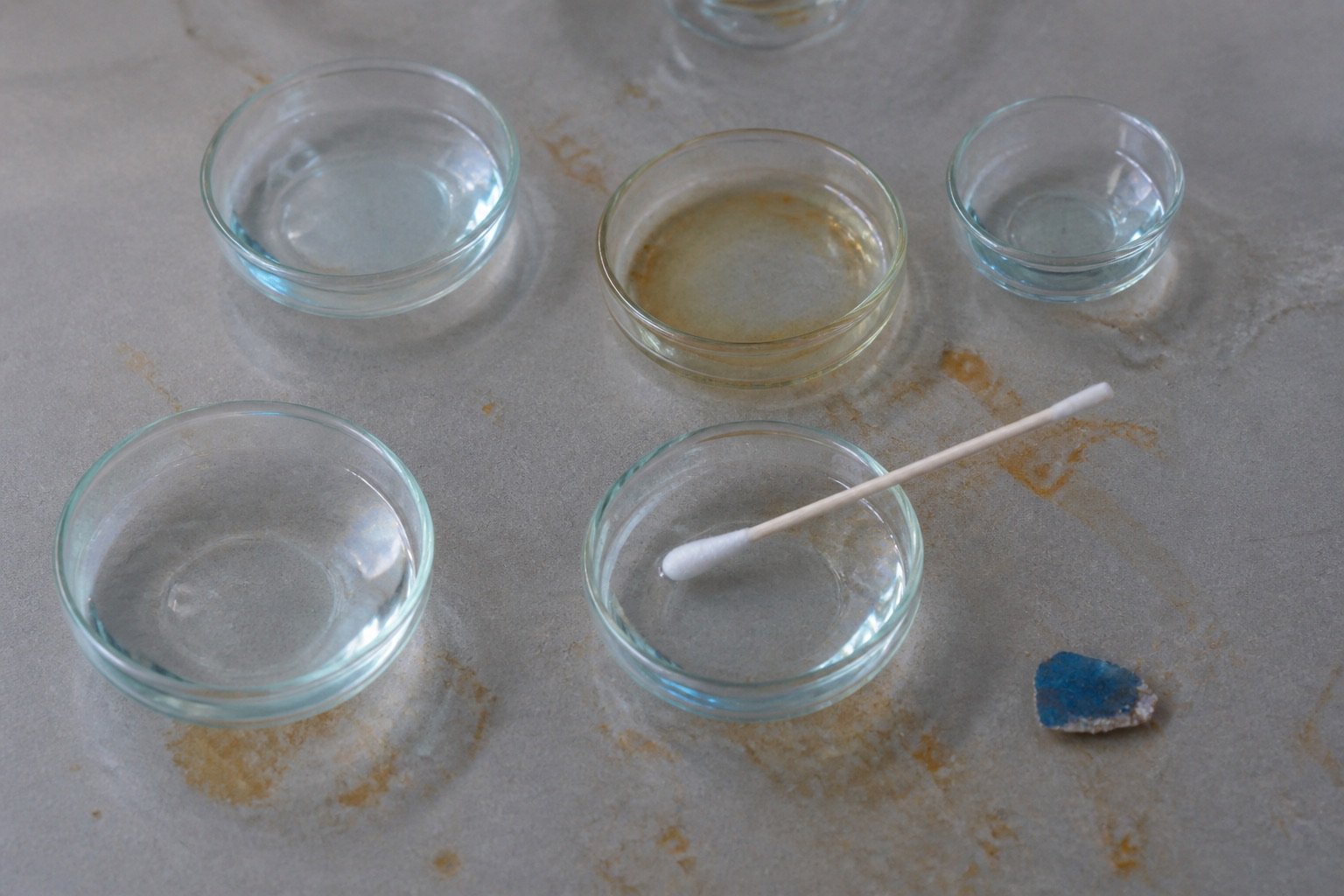Glass dishes beside a cotton swab on the recovery table